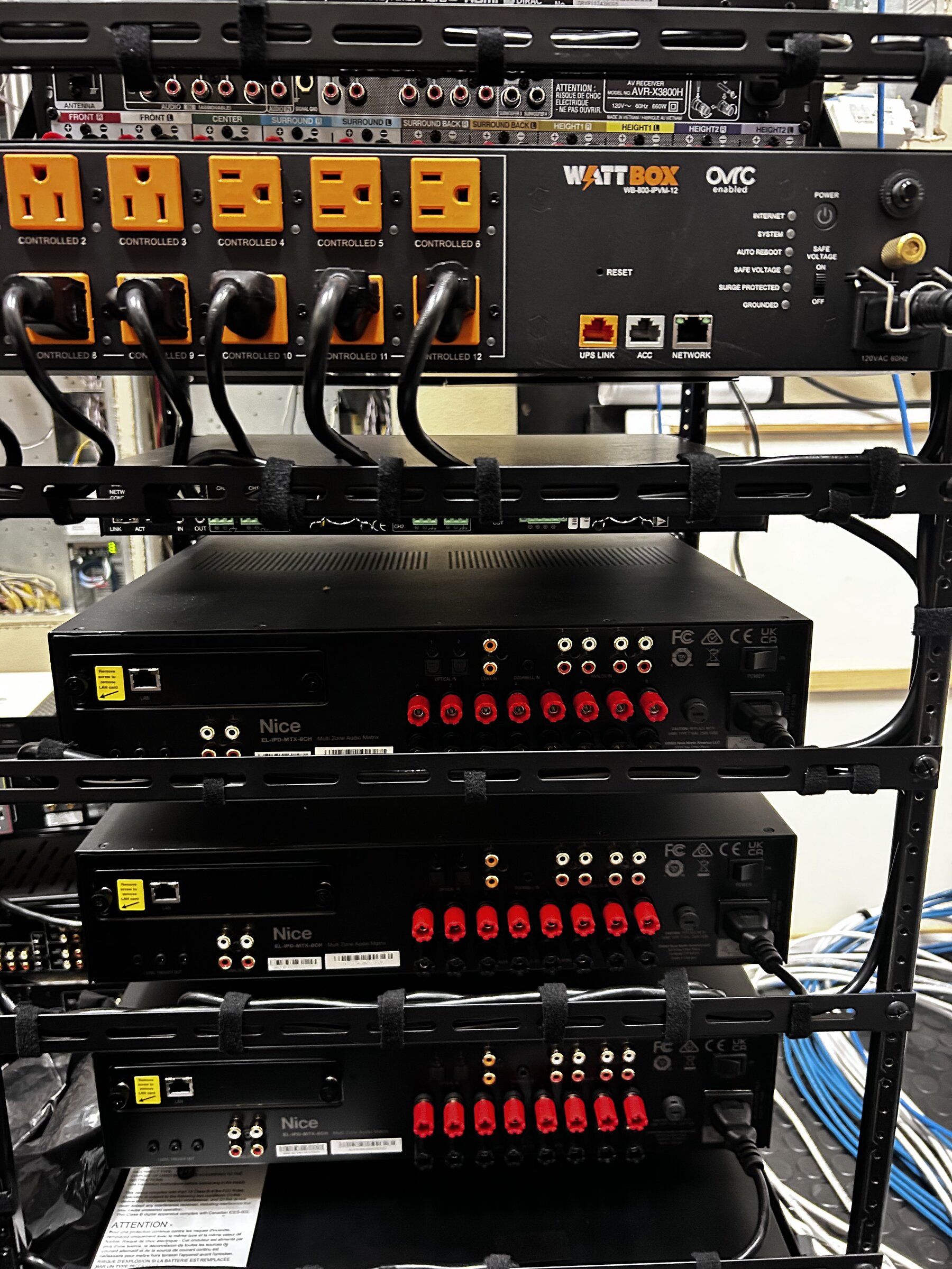 Rack-mounted audio and network equipment, precisely wired and labeled